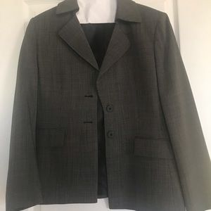 Women’s black business pantsuit.